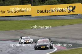 Bruno Spengler (CAN) BMW Team Schnitzer BMW M3 DTM and Marco Wittmann (GER) BMW Team MTEK BMW M3 DTM 02.06.2013, DTM Round 3, Spielberg, Austria, Sunday.