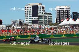 Lewis Hamilton (GBR) Mercedes AMG F1 W04 leads Sergio Perez (MEX) McLaren MP4-28. 15.03.2013. Formula 1 World Championship, Rd 1, Australian Grand Prix, Albert Park, Melbourne, Australia, Practice Day.