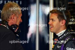 (L to R): Dr Helmut Marko (AUT) Red Bull Motorsport Consultant with Sebastian Vettel (GER) Red Bull Racing. 15.03.2013. Formula 1 World Championship, Rd 1, Australian Grand Prix, Albert Park, Melbourne, Australia, Practice Day.