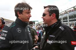 (L to R): Toto Wolff (GER) Mercedes AMG F1 Shareholder and Executive Director with Eric Boullier (FRA) Lotus F1 Team Principal on the grid. 17.03.2013. Formula 1 World Championship, Rd 1, Australian Grand Prix, Albert Park, Melbourne, Australia, Race Day.