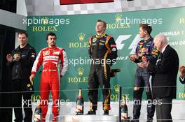 The podium (L to R): Fernando Alonso (ESP) Ferrari, second; Kimi Raikkonen (FIN) Lotus F1 Team, race winner; Sebastian Vettel (GER) Red Bull Racing, third. 17.03.2013. Formula 1 World Championship, Rd 1, Australian Grand Prix, Albert Park, Melbourne, Australia, Race Day.