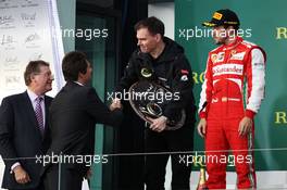 Alan Permane (GBR) Lotus F1 Team Trackside Operations Director collects his trophy on the podium from Arnaud Boetsch, Rolex Communication and Image Director. 17.03.2013. Formula 1 World Championship, Rd 1, Australian Grand Prix, Albert Park, Melbourne, Australia, Race Day.