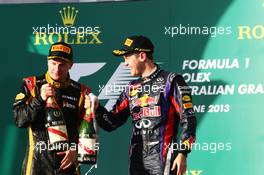 (L to R): Race winner Kimi Raikkonen (FIN) Lotus F1 Team celebrates on the podium with Sebastian Vettel (GER) Red Bull Racing. 17.03.2013. Formula 1 World Championship, Rd 1, Australian Grand Prix, Albert Park, Melbourne, Australia, Race Day.