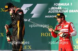 (L to R): Race winner Kimi Raikkonen (FIN) Lotus F1 Team celebrates with Fernando Alonso (ESP) Ferrari on the podium. 17.03.2013. Formula 1 World Championship, Rd 1, Australian Grand Prix, Albert Park, Melbourne, Australia, Race Day.