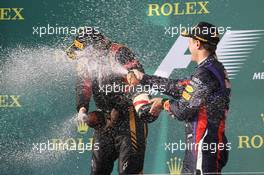 Race winner Kimi Raikkonen (FIN) Lotus F1 Team celebrates on the podium with Sebastian Vettel (GER) Red Bull Racing. 17.03.2013. Formula 1 World Championship, Rd 1, Australian Grand Prix, Albert Park, Melbourne, Australia, Race Day.