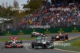 Nico Rosberg (GER) Mercedes AMG F1 W04 leads Jenson Button (GBR) McLaren MP4-28. 17.03.2013. Formula 1 World Championship, Rd 1, Australian Grand Prix, Albert Park, Melbourne, Australia, Race Day.