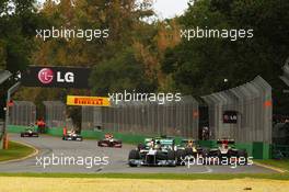 Lewis Hamilton (GBR) Mercedes AMG F1 W04 and Kimi Raikkonen (FIN) Lotus F1 E21. 17.03.2013. Formula 1 World Championship, Rd 1, Australian Grand Prix, Albert Park, Melbourne, Australia, Race Day.