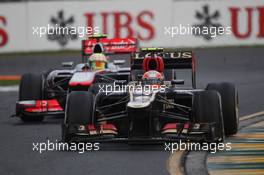 Romain Grosjean (FRA) Lotus F1 E21 leads Sergio Perez (MEX) McLaren MP4-28. 17.03.2013. Formula 1 World Championship, Rd 1, Australian Grand Prix, Albert Park, Melbourne, Australia, Race Day.