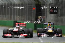 Jenson Button (GBR) McLaren MP4-28 leads Mark Webber (AUS) Red Bull Racing RB9. 17.03.2013. Formula 1 World Championship, Rd 1, Australian Grand Prix, Albert Park, Melbourne, Australia, Race Day.