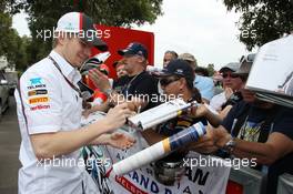 Nico Hulkenberg (GER) Sauber signs autographs for the fans. 16.03.2013. Formula 1 World Championship, Rd 1, Australian Grand Prix, Albert Park, Melbourne, Australia, Qualifying Day.