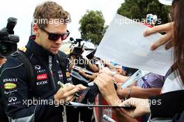 Sebastian Vettel (GER) Red Bull Racing signs autographs for the fans. 16.03.2013. Formula 1 World Championship, Rd 1, Australian Grand Prix, Albert Park, Melbourne, Australia, Qualifying Day.