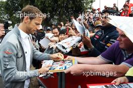 Jenson Button (GBR) McLaren signs autographs for the fans. 16.03.2013. Formula 1 World Championship, Rd 1, Australian Grand Prix, Albert Park, Melbourne, Australia, Qualifying Day.