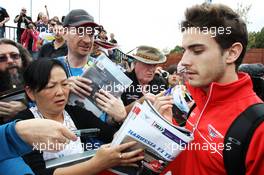 Jules Bianchi (FRA) Marussia F1 Team MR02 signs autographs for the fans. 16.03.2013. Formula 1 World Championship, Rd 1, Australian Grand Prix, Albert Park, Melbourne, Australia, Qualifying Day.