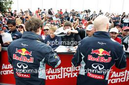 (L to R): Christian Horner (GBR) Red Bull Racing Team Principal and Adrian Newey (GBR) Red Bull Racing Chief Technical Officer sign autographs for the fans. 16.03.2013. Formula 1 World Championship, Rd 1, Australian Grand Prix, Albert Park, Melbourne, Australia, Qualifying Day.