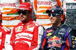 (L to R): Fernando Alonso (ESP) Ferrari and Sebastian Vettel (GER) Red Bull Racing at the start of year drivers photo. 17.03.2013. Formula 1 World Championship, Rd 1, Australian Grand Prix, Albert Park, Melbourne, Australia, Race Day.