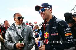 (L to R): Lewis Hamilton (GBR) Mercedes AMG F1 and Sebastian Vettel (GER) Red Bull Racing on the drivers parade. 17.03.2013. Formula 1 World Championship, Rd 1, Australian Grand Prix, Albert Park, Melbourne, Australia, Race Day.