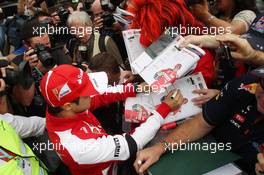 Felipe Massa (BRA) Ferrari signs autographs for the fans. 14.03.2013. Formula 1 World Championship, Rd 1, Australian Grand Prix, Albert Park, Melbourne, Australia, Preparation Day.