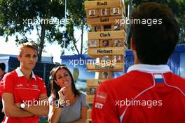 Jules Bianchi (FRA) Marussia F1 Team, team mate Max Chilton (GBR) Marussia F1 Team and Natalie Pinkham (GBR) Sky Sports Presenter play F1 driver Jenga. 14.03.2013. Formula 1 World Championship, Rd 1, Australian Grand Prix, Albert Park, Melbourne, Australia, Preparation Day.