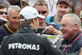 (L to R): Nico Rosberg (GER) Mercedes AMG F1 with Alan Jones (AUS). 14.03.2013. Formula 1 World Championship, Rd 1, Australian Grand Prix, Albert Park, Melbourne, Australia, Preparation Day.