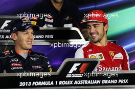 (L to R): Sebastian Vettel (GER) Red Bull Racing and Fernando Alonso (ESP) Ferrari in the FIA Press Conference. 14.03.2013. Formula 1 World Championship, Rd 1, Australian Grand Prix, Albert Park, Melbourne, Australia, Preparation Day.