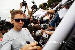 Sebastian Vettel (GER) Red Bull Racing signs autographs for the fans. 14.03.2013. Formula 1 World Championship, Rd 1, Australian Grand Prix, Albert Park, Melbourne, Australia, Preparation Day.