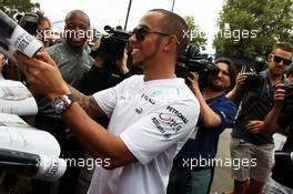 Lewis Hamilton (GBR) Mercedes AMG F1 signs autographs for the fans. 14.03.2013. Formula 1 World Championship, Rd 1, Australian Grand Prix, Albert Park, Melbourne, Australia, Preparation Day.