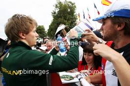 Charles Pic (FRA) Caterham signs autographs for the fans. 14.03.2013. Formula 1 World Championship, Rd 1, Australian Grand Prix, Albert Park, Melbourne, Australia, Preparation Day.