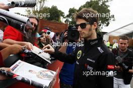 Romain Grosjean (FRA) Lotus F1 Team signs autographs for the fans. 14.03.2013. Formula 1 World Championship, Rd 1, Australian Grand Prix, Albert Park, Melbourne, Australia, Preparation Day.