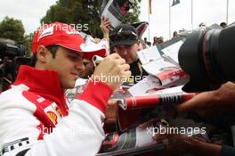 Felipe Massa (BRA) Ferrari signs autographs for the fans. 14.03.2013. Formula 1 World Championship, Rd 1, Australian Grand Prix, Albert Park, Melbourne, Australia, Preparation Day.