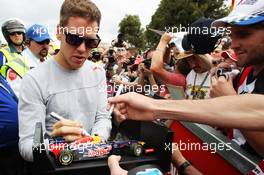 Sebastian Vettel (GER) Red Bull Racing signs autographs for the fans. 14.03.2013. Formula 1 World Championship, Rd 1, Australian Grand Prix, Albert Park, Melbourne, Australia, Preparation Day.