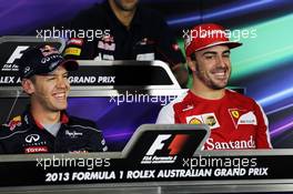 (L to R): Sebastian Vettel (GER) Red Bull Racing and Fernando Alonso (ESP) Ferrari in the FIA Press Conference. 14.03.2013. Formula 1 World Championship, Rd 1, Australian Grand Prix, Albert Park, Melbourne, Australia, Preparation Day.