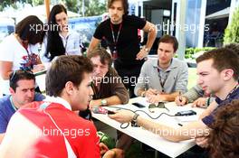 Jules Bianchi (FRA) Marussia F1 Team with the media. 14.03.2013. Formula 1 World Championship, Rd 1, Australian Grand Prix, Albert Park, Melbourne, Australia, Preparation Day.