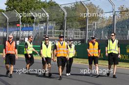 Casey Stoner (AUS) former Moto GP Rider and V8 Supercar Driver and the Tripe Eight team walk the circuit wearing high vis jackets. 13.03.2013. Formula 1 World Championship, Rd 1, Australian Grand Prix, Albert Park, Melbourne, Australia, Preparation Day.