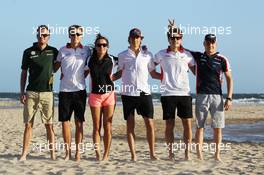 Rookie drivers on the beach (L to R): Giedo van der Garde (NLD) Caterham F1 Team; Max Chilton (GBR) Marussia F1 Team; Natalie Pinkham (GBR) Sky Sports Presenter; Esteban Gutierrez (MEX) Sauber; Jules Bianchi (FRA) Marussia F1 Team; Valtteri Bottas (FIN) Williams. 13.03.2013. Formula 1 World Championship, Rd 1, Australian Grand Prix, Albert Park, Melbourne, Australia, Preparation Day.