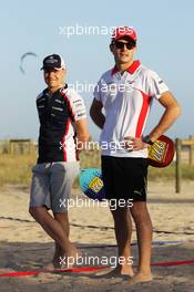 Jules Bianchi (FRA) Marussia F1 Team (Right) and Valtteri Bottas (FIN) Williams play beach tennis. 13.03.2013. Formula 1 World Championship, Rd 1, Australian Grand Prix, Albert Park, Melbourne, Australia, Preparation Day.