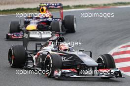 Nico Hulkenberg (GER) Sauber C32 leads Mark Webber (AUS) Red Bull Racing RB9. 21.02.2013. Formula One Testing, Day Three, Barcelona, Spain.