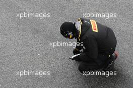 Pirelli tyre technician. 01.03.2013. Formula One Testing, Day Two, Barcelona, Spain.