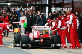 Fernando Alonso (ESP) Ferrari F138 returns to the pits with something attached to the fuel nozzle. 01.03.2013. Formula One Testing, Day Two, Barcelona, Spain.