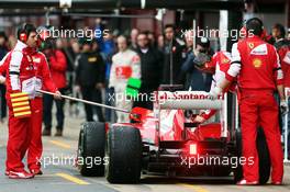 Fernando Alonso (ESP) Ferrari F138 returns to the pits with something attached to the fuel nozzle. 01.03.2013. Formula One Testing, Day Two, Barcelona, Spain.