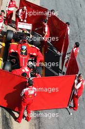 Fernando Alonso (ESP) Ferrari F138 in the pits behind red screens. 03.03.2013. Formula One Testing, Day Four, Barcelona, Spain.