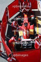 Fernando Alonso (ESP) Ferrari F138 in the pits behind red screens. 03.03.2013. Formula One Testing, Day Four, Barcelona, Spain.