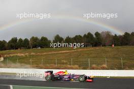 Mark Webber (AUS) Red Bull Racing RB9 passes a rainbow. 28.02.2013. Formula One Testing, Day One, Barcelona, Spain.