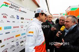 Adrian Sutil (GER) Sahara Force India F1 with the media. 28.02.2013. Formula One Testing, Day One, Barcelona, Spain.