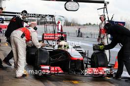 Sergio Perez (MEX) McLaren MP4-28 in the pits. 28.02.2013. Formula One Testing, Day One, Barcelona, Spain.