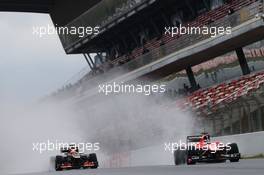 Romain Grosjean (FRA) Lotus F1 E21 and Max Chilton (GBR) Marussia F1 Team MR02. 28.02.2013. Formula One Testing, Day One, Barcelona, Spain.