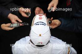 Adrian Sutil (GER) Sahara Force India F1 with the media following the confirmation of  his seat with the team in 2013. 28.02.2013. Formula One Testing, Day One, Barcelona, Spain.