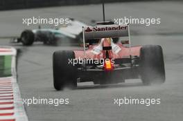 Felipe Massa (BRA) Ferrari F138 chases Lewis Hamilton (GBR) Mercedes AMG F1 W04. 28.02.2013. Formula One Testing, Day One, Barcelona, Spain.