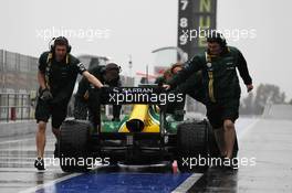 Charles Pic (FRA) Caterham CT03 is pushed back in the pits. 28.02.2013. Formula One Testing, Day One, Barcelona, Spain.