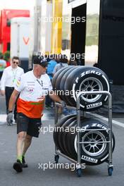 Sahara Force India F1 Team mechanic with Pirelli tyres. 23.08.2013. Formula 1 World Championship, Rd 11, Belgian Grand Prix, Spa Francorchamps, Belgium, Practice Day.