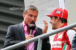 (L to R): A wet David Coulthard (GBR) Red Bull Racing and Scuderia Toro Advisor / BBC Television Commentator with Fernando Alonso (ESP) Ferrari on the podium. 25.08.2013. Formula 1 World Championship, Rd 11, Belgian Grand Prix, Spa Francorchamps, Belgium, Race Day.